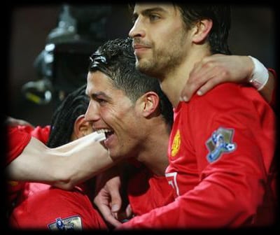 MANCHESTER, UNITED KINGDOM - MARCH 19:  Cristiano Ronaldo of Manchester United (2R) celebrates with team mates Nemanja Vidic (L), Louis Saha (2L) and Gerard Pique (R) as he scores their first goal during the Barclays Premier League match between Manchester United and Bolton Wanderers at Old Trafford on March 19, 2008 in Manchester, England.  (Photo by Alex Livesey/Getty Images)